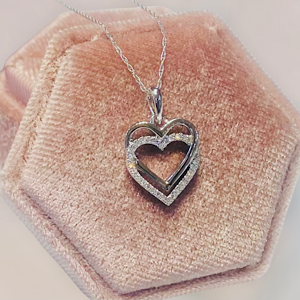 14kt White Interlocking Heart approx .50in long .08ctw Diamonds on a 18" Chain