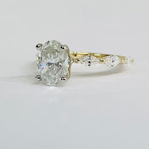 Custom 14kt Yellow Gold Ring Containing 1.50ct Oval Diamond
