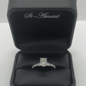 White Gold Engagement Ring Conatining: Approx 1.01ct oval damond color H, clarity SI1; approx .15tw round diamonds in band